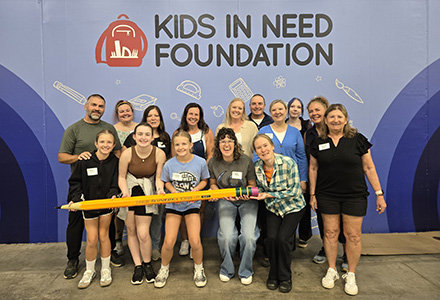 Group shot of event attendees at Kids In Need Foundation